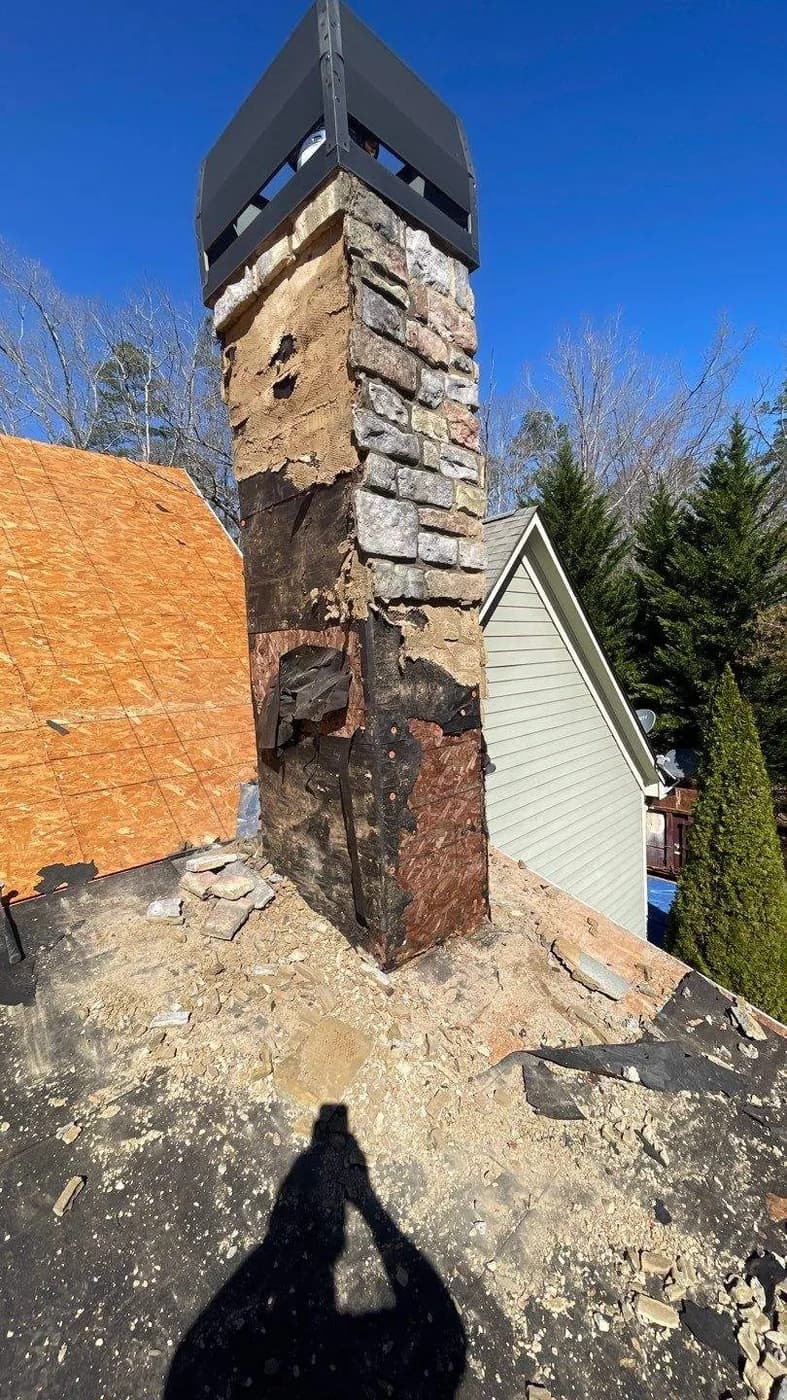Chimney rebuild in progress, demolished to the structure before reframing, by Platinum Roofing