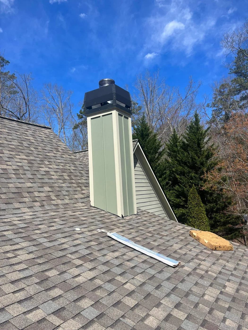 New chimney shroud and metal chimney pan cap installed on a North Atlanta roof by Platinum Roofing