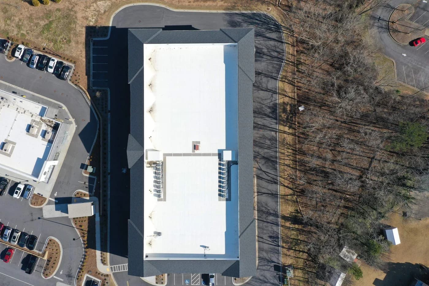 Aerial view of a new white TPO membrane roof on a metro Atlanta commercial building