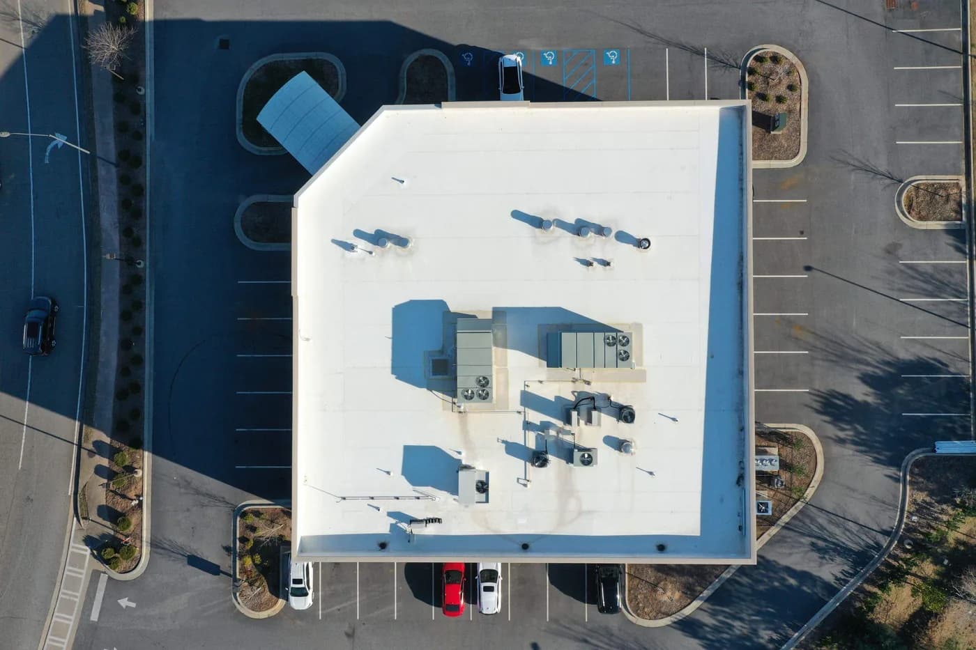 Commercial flat roof restoration in progress on an Atlanta-area building