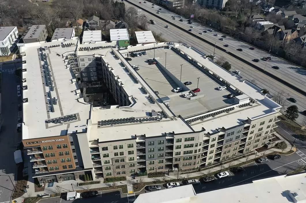 Aerial view of a multi-building apartment community roofed by Platinum Roofing in metro Atlanta