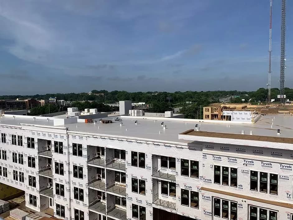 Drone view of a completed commercial apartment roof project in North Atlanta