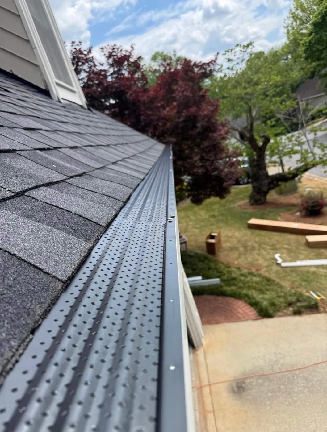 Mesh gutter guard installed over a new seamless gutter on a North Georgia home