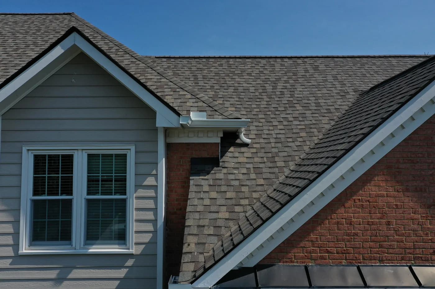 Newly installed seamless gutters and downspouts on a metro Atlanta home