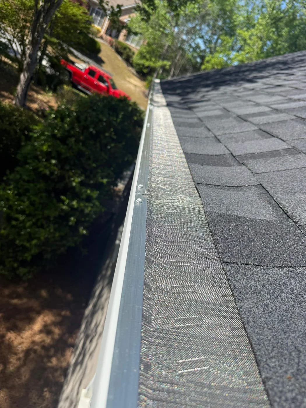 Clean seamless aluminum gutter run with leaf-free flow installed by Platinum Roofing in North Atlanta