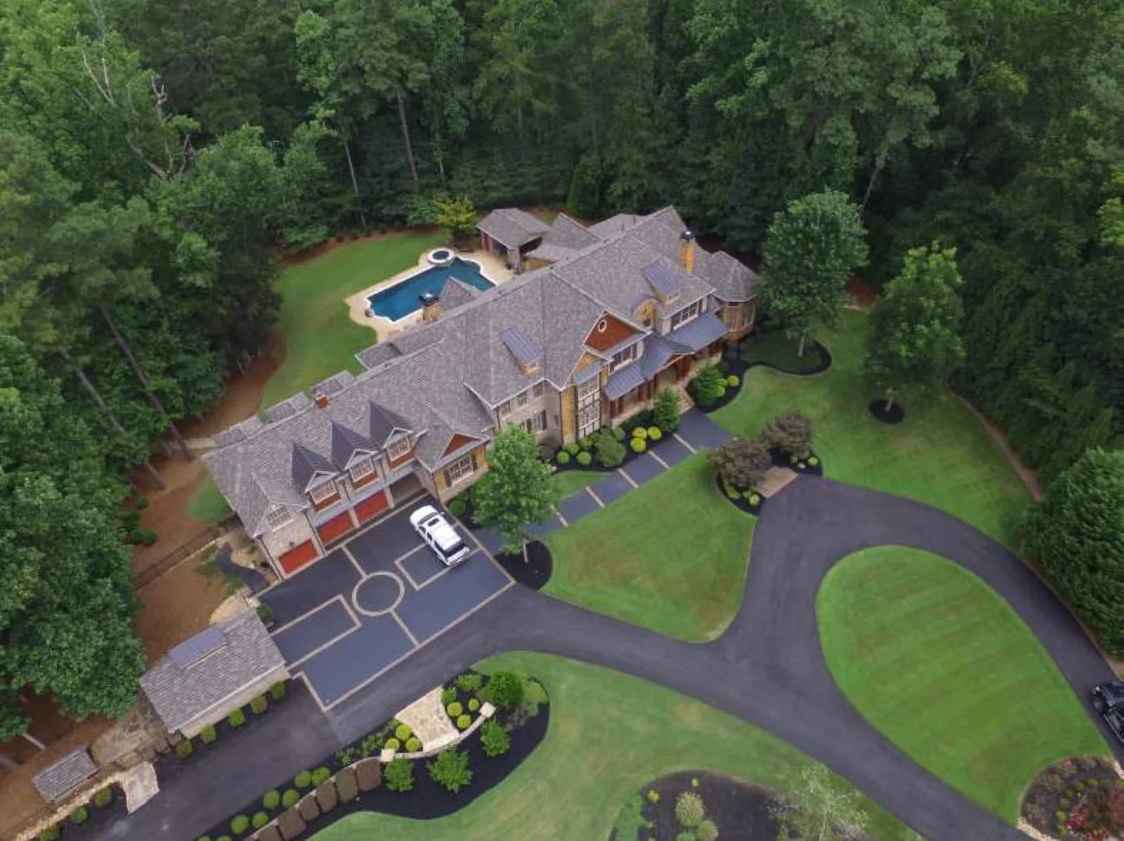 A completed residential roof replacement on a large North Georgia home, shown from above by Platinum Roofing