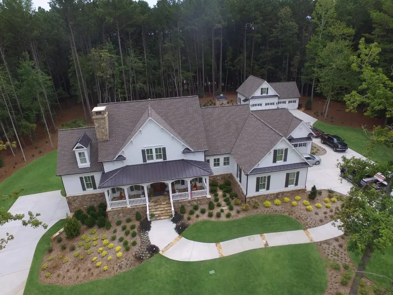 A North Georgia home with a properly ridge-vented architectural shingle roof installed by Platinum Roofing