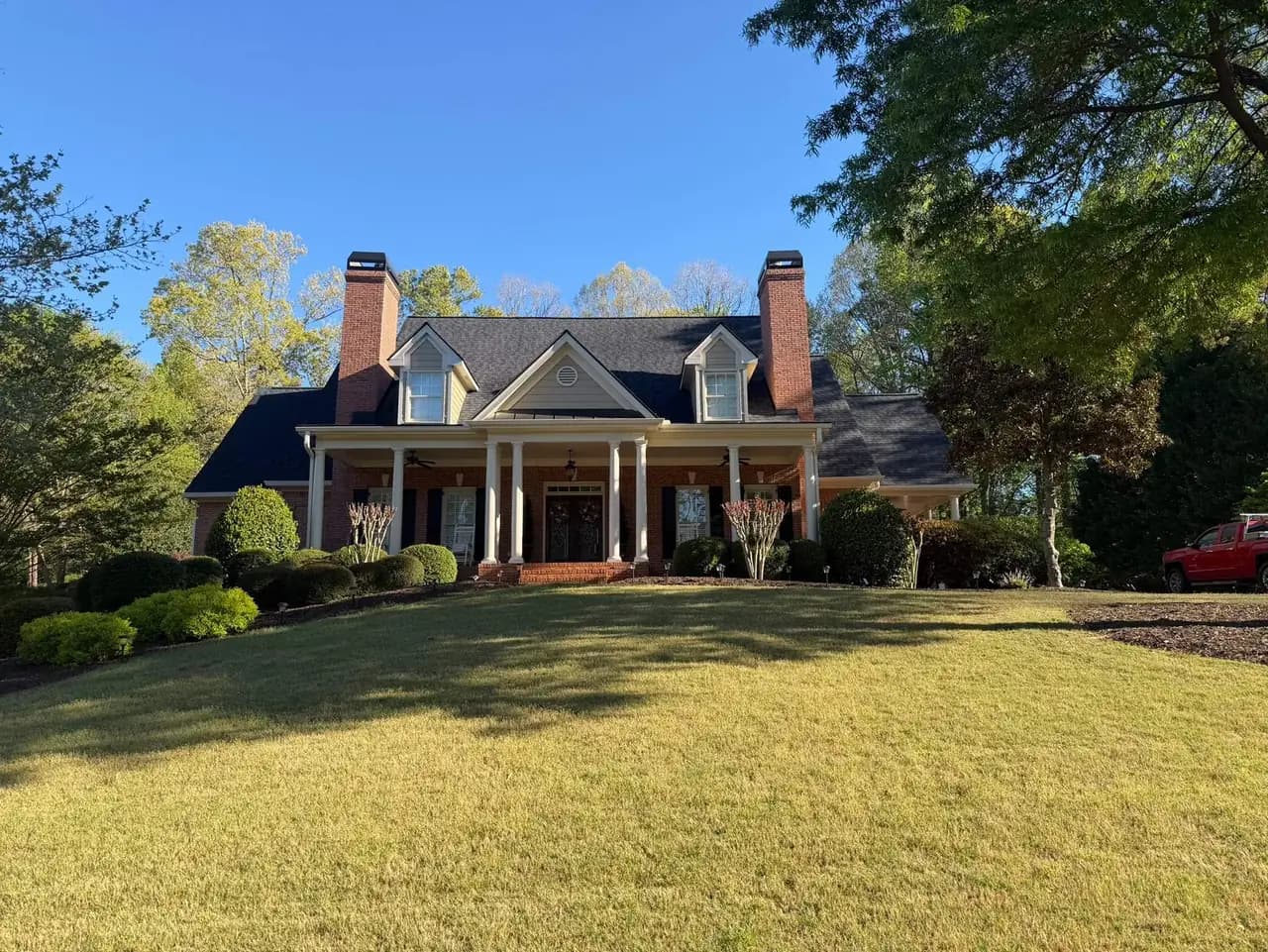 Completed residential roof replacement on a North Atlanta estate home with new architectural shingles by Platinum Roofing