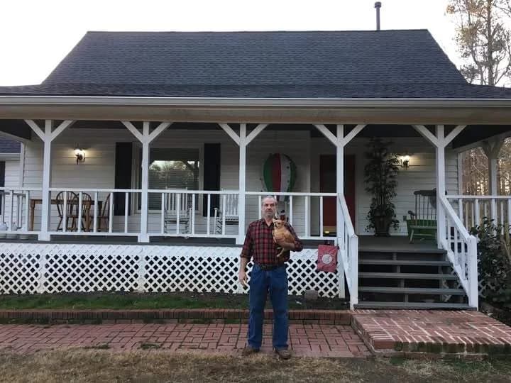 Completed shingle roof replacement on a North Georgia home with mature landscaping