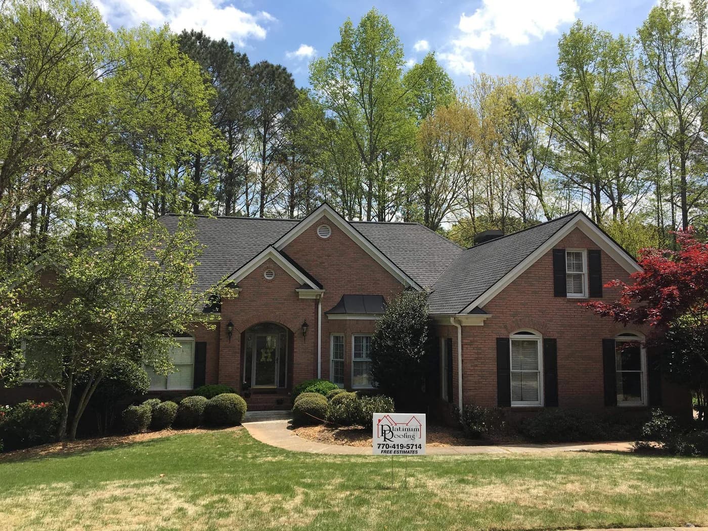 Newly installed architectural shingle roof on a covered-porch home in North Atlanta