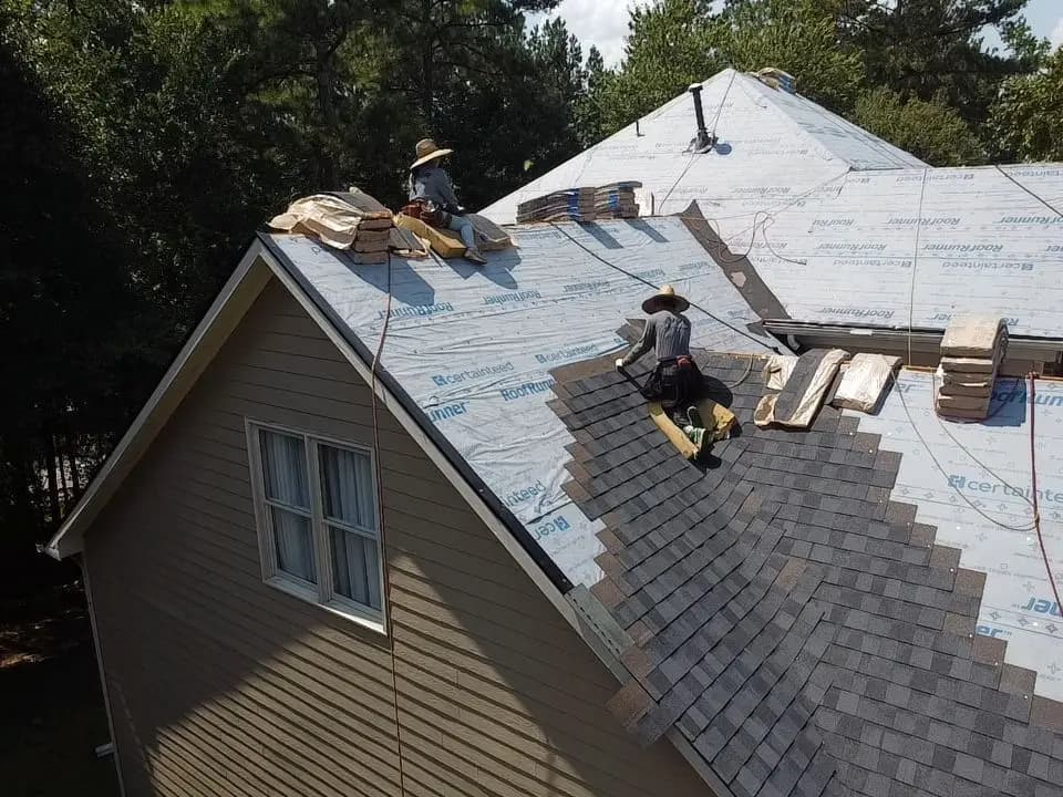 Platinum Roofing crew tearing off an old roof in Alpharetta, GA