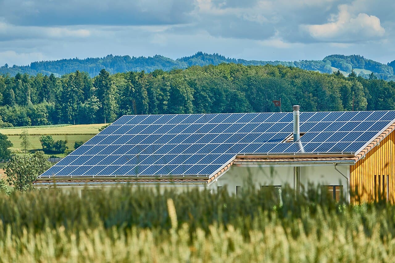 A home with its roof fully covered by a rooftop solar array installed on a sound shingle deck