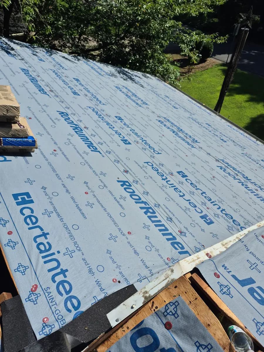 CertainTeed synthetic underlayment going down during a Kennesaw, GA roof replacement
