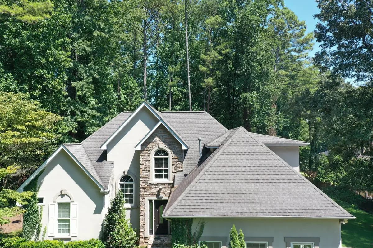 Stone-front home with a finished shingle roof in Marietta, GA
