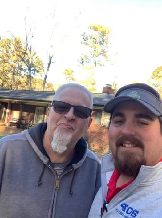 A Platinum Roofing team member with a homeowner on a completed roofing project