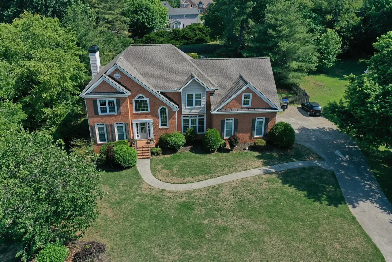 A North Georgia roof before and after a legitimate storm-damage replacement