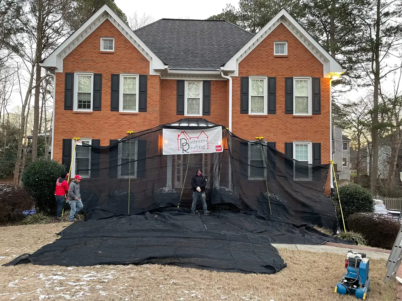 A Platinum Roofing crew on site in North Georgia with the property protected before work begins